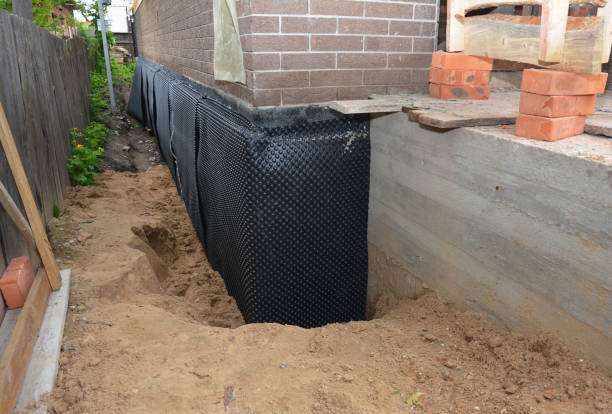 Happy homeowners after waterproofing job in Highland
